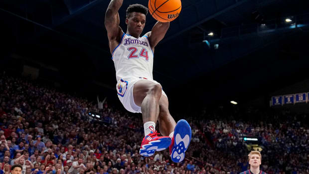 Dec 1, 2023; Lawrence, Kansas, USA; Kansas Jayhawks forward K.J. Adams Jr. (24) dunks the ball against the Connecticut Huskies during the second half at Allen Fieldhouse. 